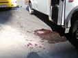 Без крові не обійшлося: конфлікт маршрутників у столиці закінчився бійкою з різаниною (фото)