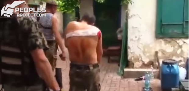 Один з поранених бійців. Фото: скріншот з відео.