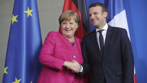 Меркель та Макрон будуть протидіяти Путіну разом? Фото: Рейтерс.
