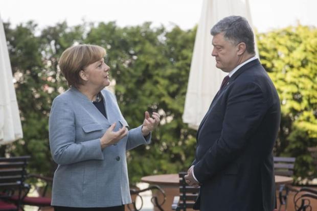 Ангела Меркель та Петро Порошенко під час зустрічі у Німеччині. Фото:24 канал