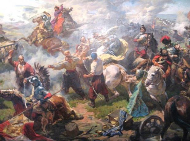 Максим Залізняк (на коні) зі своїми козаками рубиться з польською шляхтою