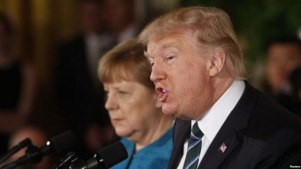 Трамп розкритикував політику Меркель. Фото: Рейтерс.
