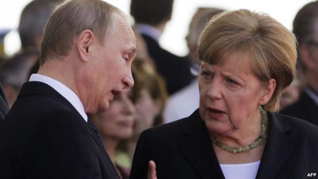 Путін і Меркель. Фото: AFP.