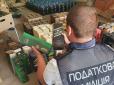 Торгували через інтернет: На Київщині накрили величезний цех з виготовлення фальсифікованого алкоголю (фото)